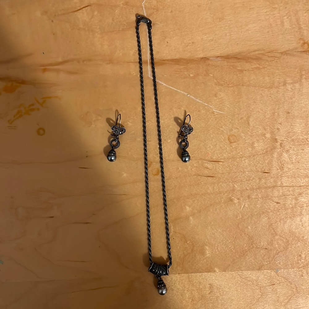 Museum store necklace and earrings with dark pearls.